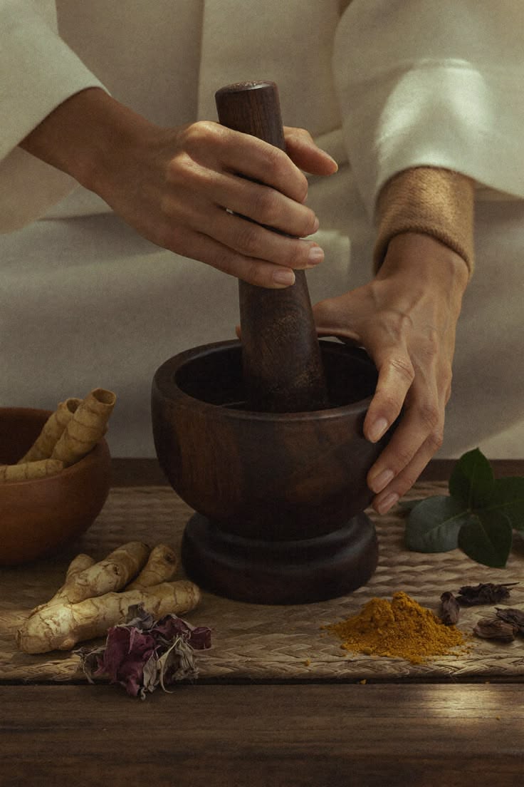 Illustrative botanical preparation with a mortar and pestle, not the retail product